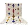 ​Handmade colorful Azilal Moroccan wool rug with traditional Amazigh geometric patterns by ASBED Cooperative